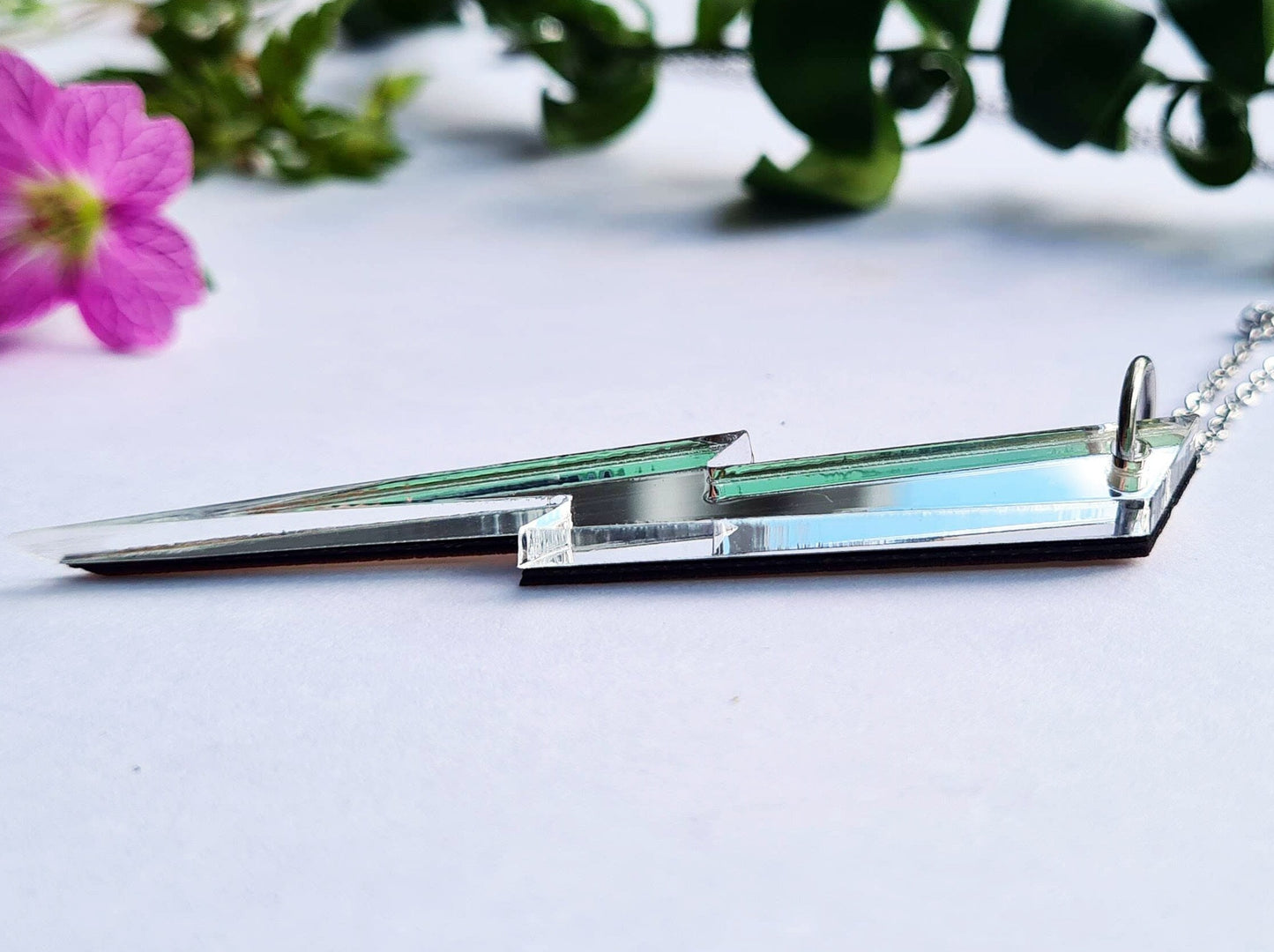 Long, slender Lightning bolt in silver mirror