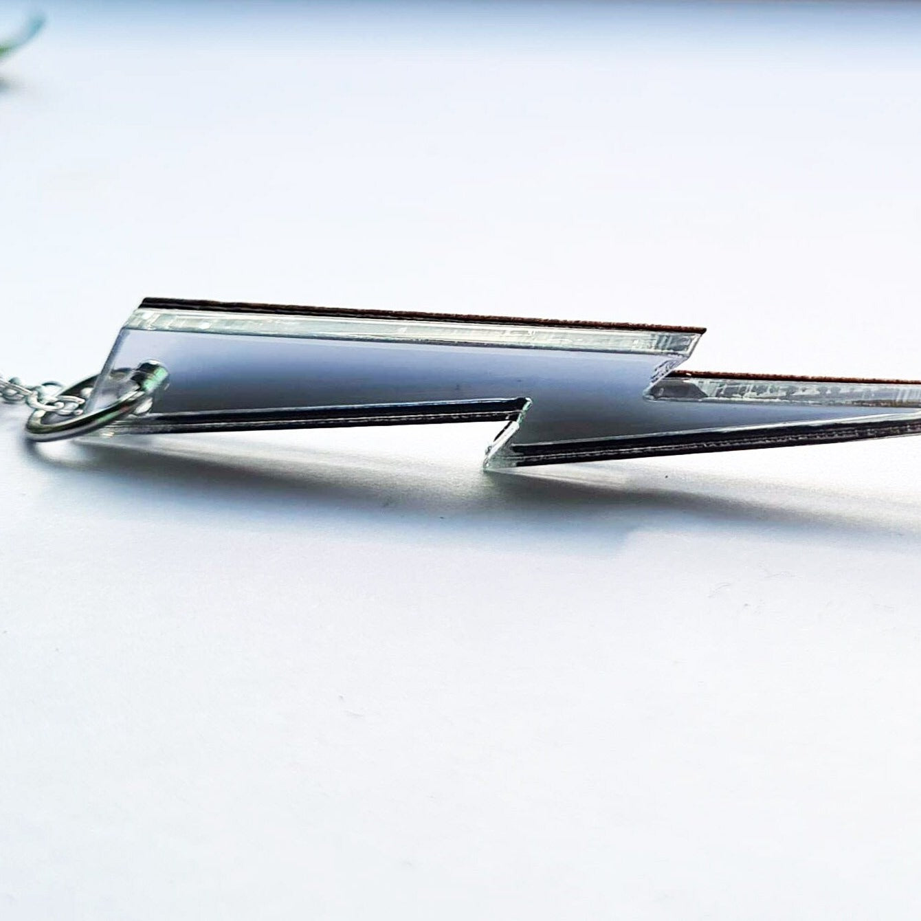 Long, slender Lightning bolt in silver mirror