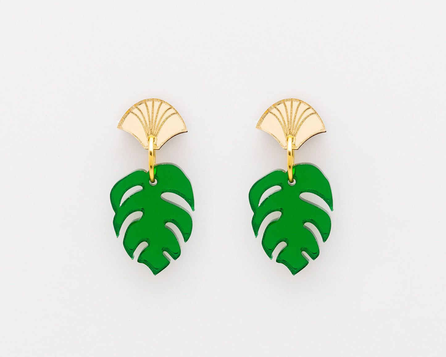 Green leaf-shaped earrings with gold hooks on a white background