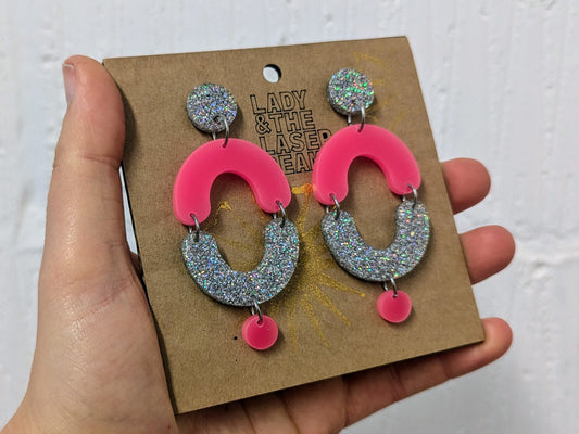 Boop earrings neon pink and holographic glitter.