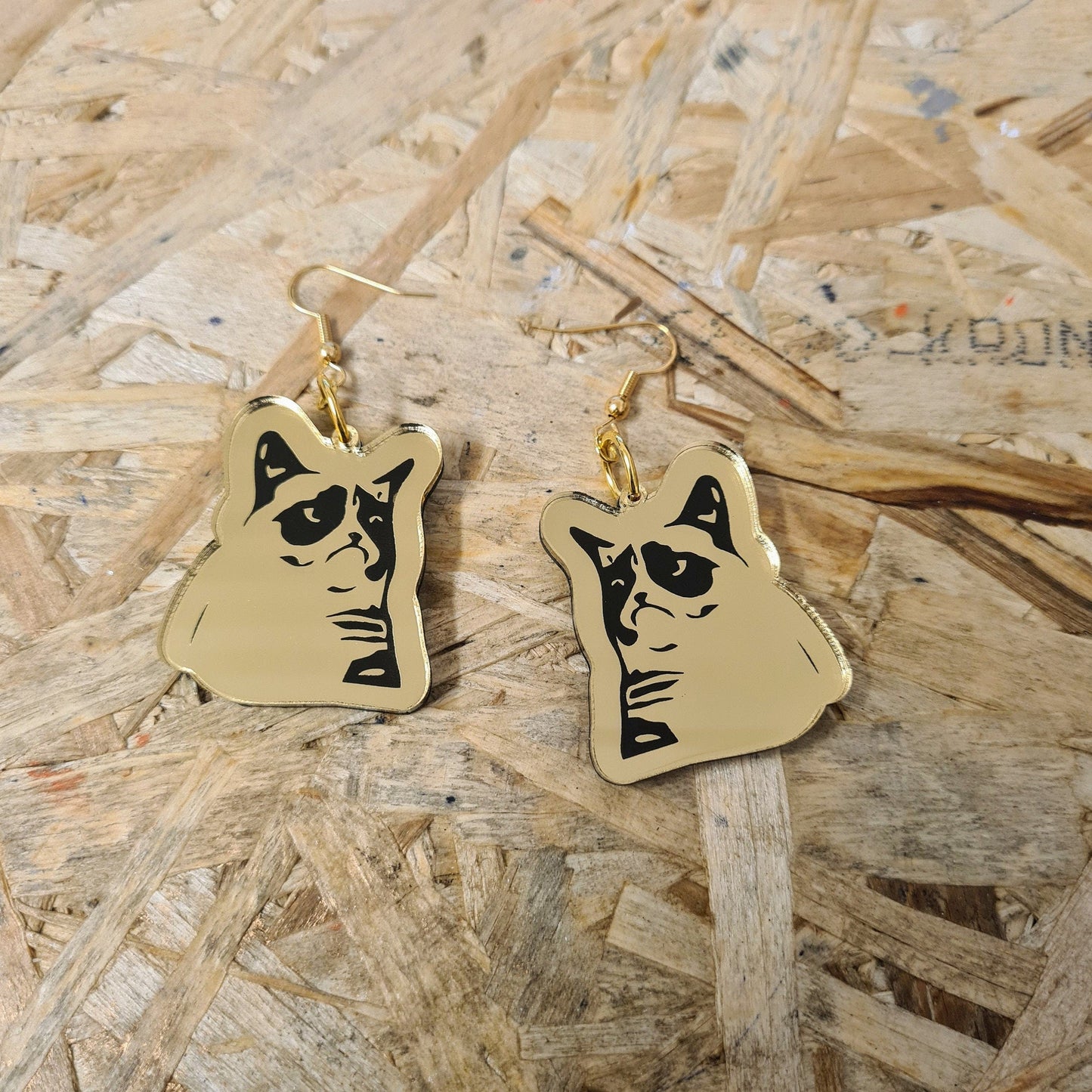 Grumpy Cat meme earrings.