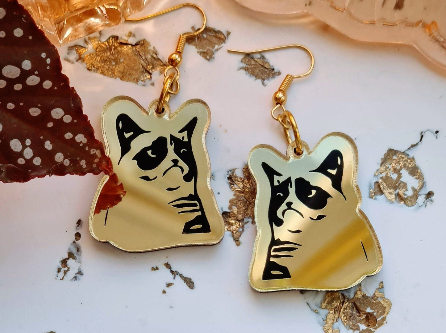 Grumpy Cat meme earrings.