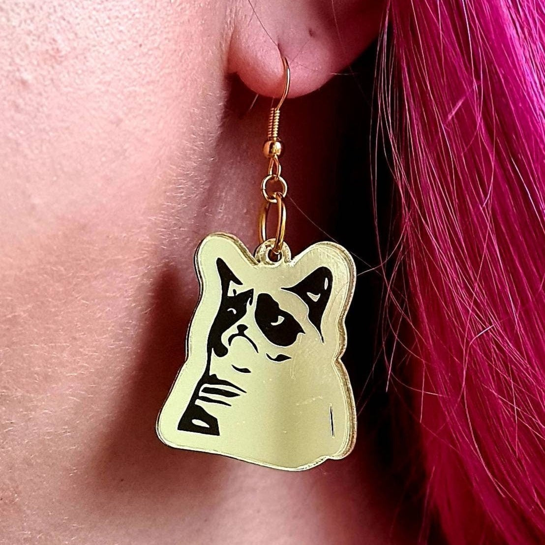 Grumpy Cat meme earrings.